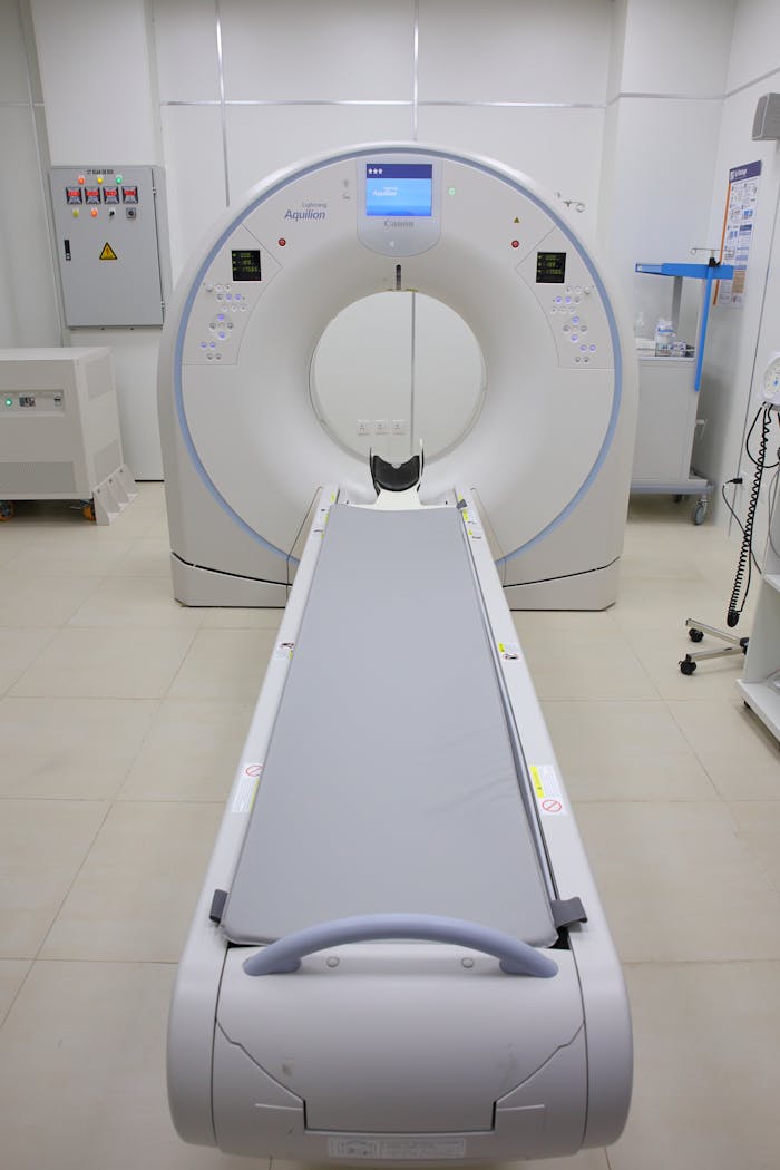Modern CT scanner in a hospital room showcasing advanced medical technology.